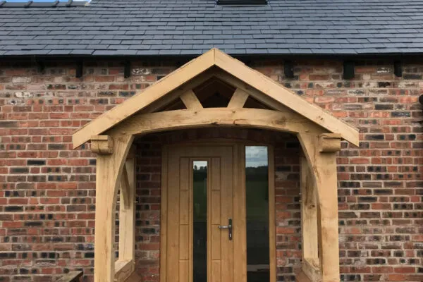 Oak Porch, Wettenhall. Low pitched roof porch
